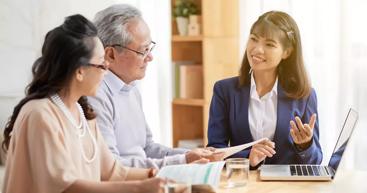 couple talking to insurance agent