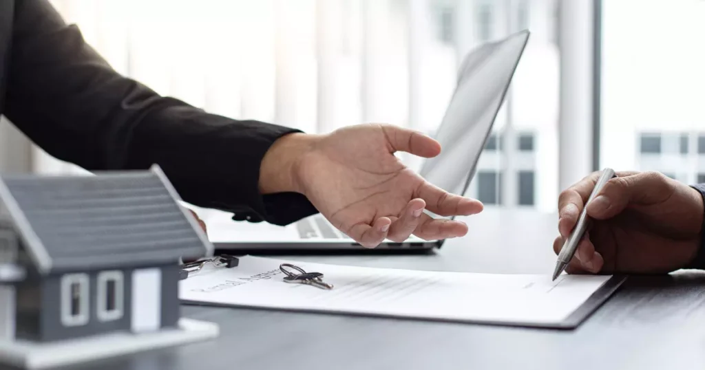 A hand reaching out to a paper