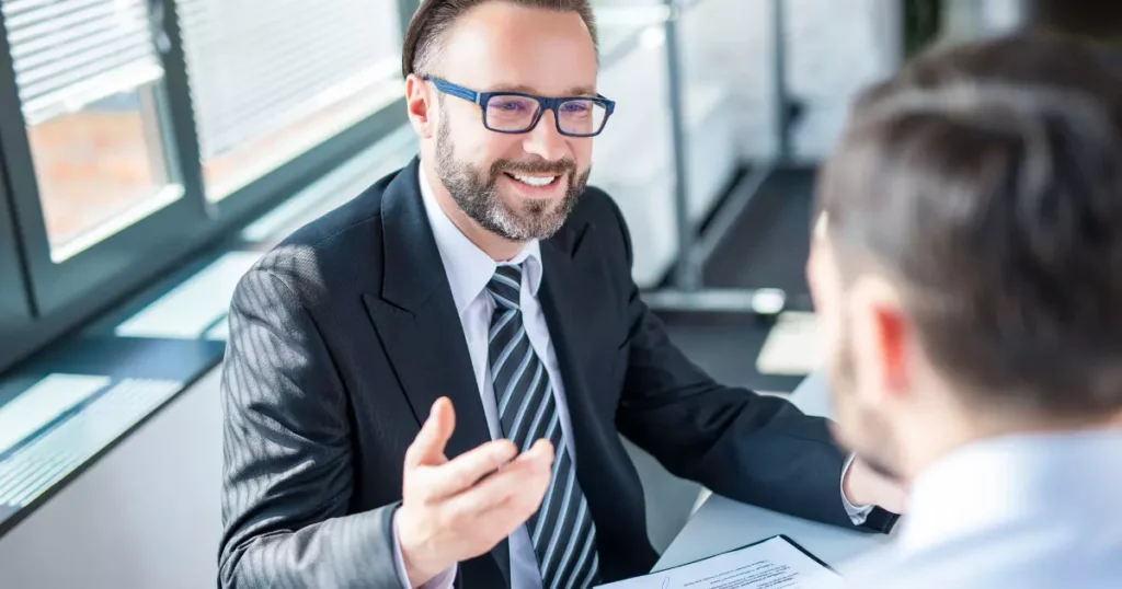 an insurance agent in a suit and tie