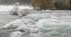 Rushing water scene linked to flood insurance