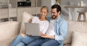 Couple reviewing renters insurance options online at home