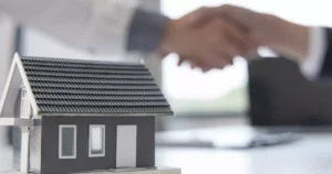 Renters insurance agreement being finalized with a handshake