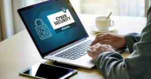 Person using a laptop displaying a cyber liability insurance warning